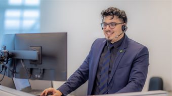 Benefits A member of a TD contact centre team smiling.