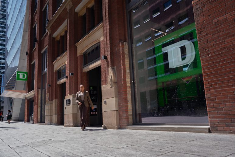 Branch A woman smiles outside a TD branch.