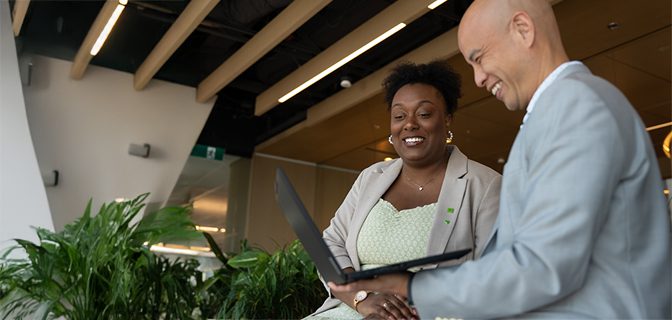 Untitled-5 Colleagues have a meeting at a conference table covered in print-outs.