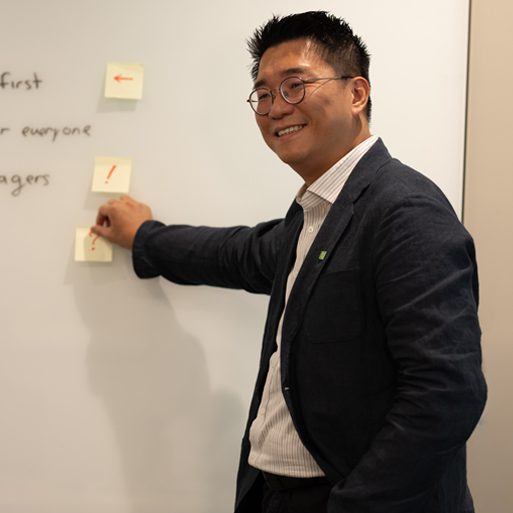 asset management A graphic designer works with a stylus while seated in front of a computer.