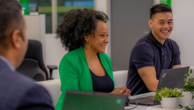 workplaces A TD colleague smiles while meeting with a colleague.