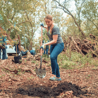 20201210_US_PA_Tree_Days_80 A colleague holding a shovel helps plant trees during a TD Tree day event.